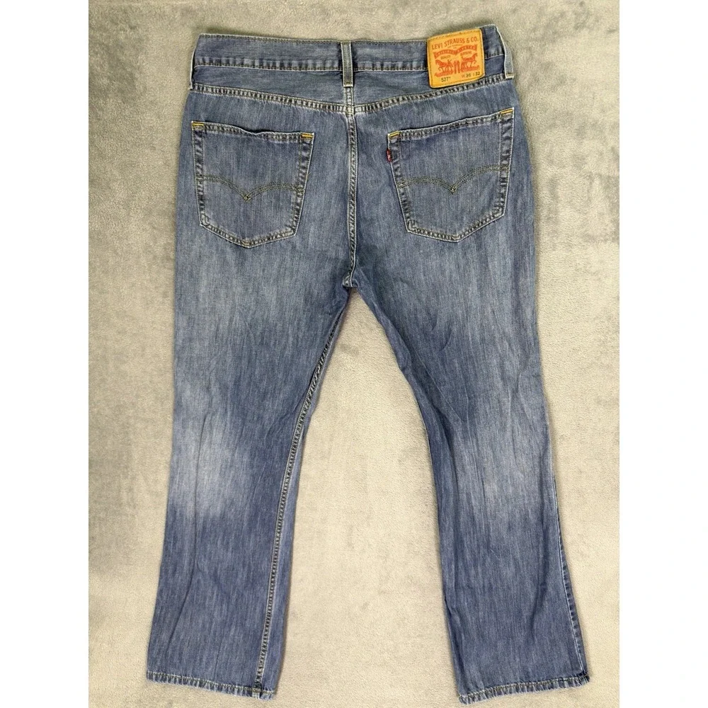 Levis‎ 527 Jeans Mens 36x32 Blue Medium Wash Distressed Denim Low Bootcut Cowboy